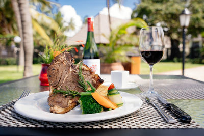 Succulent thick juicy portions of grilled fillet steak served with tomatoes and roast vegetables