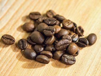 Close-up of coffee beans on table