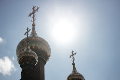 Close-up.russian christian orthodox church with domes and a cross on the background of the sky with