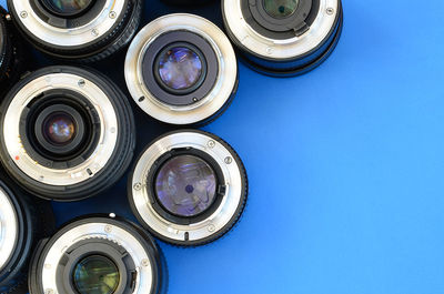 High angle view of lens on blue background