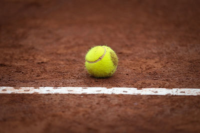 Close-up of tennis ball on field