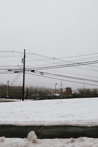 Scenic view of snow covered landscape against clear sky