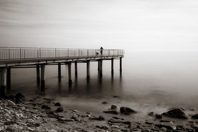 Pier on sea against sky