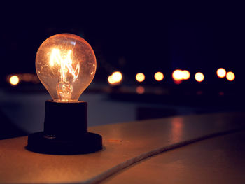 Close-up of illuminated light bulb