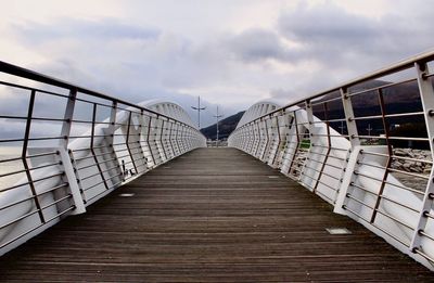 Footbridge against sky