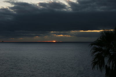 Scenic view of sea against sky at sunset