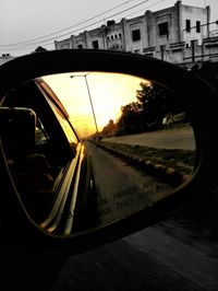 Reflection of car on side-view mirror