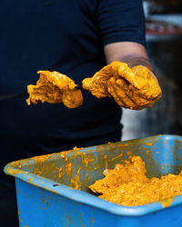 Midsection of man preparing food