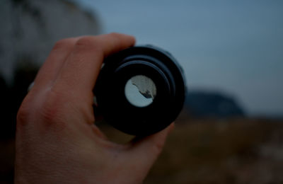 Close-up of hand holding camera