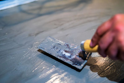 Close-up of hands working on table