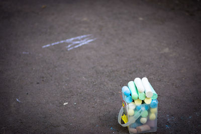 High angle view of chalks on road