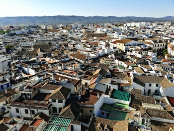 Aerial view of cityscape against sky