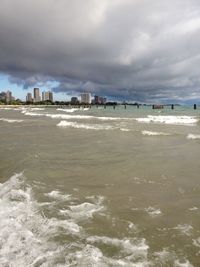 Scenic view of sea against cloudy sky