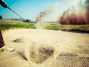 High angle view of golf course against sky