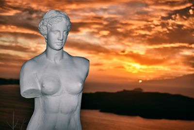 Statue against sky during sunset