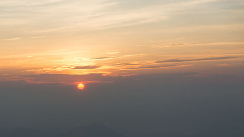 Scenic view of dramatic sky during sunset