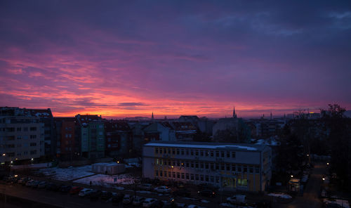 High angle view of buildings against dramatic sky