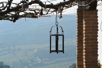 Close-up of metal structure against sky