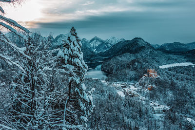 Snow covered landscape against sky