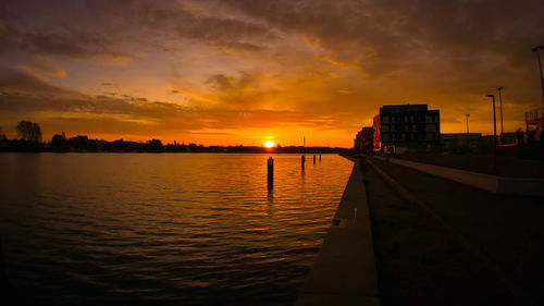 Scenic view of sunset over city