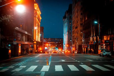 Illuminated street at night