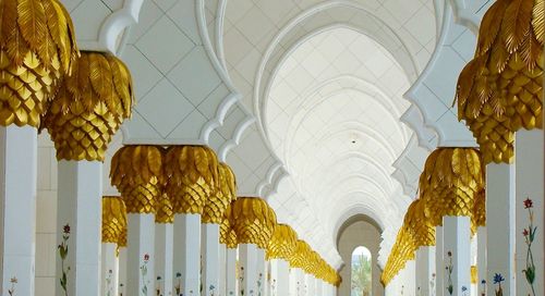 Low angle view of arches in corridor at sheikh zayed mosque