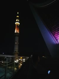 Illuminated buildings in city at night