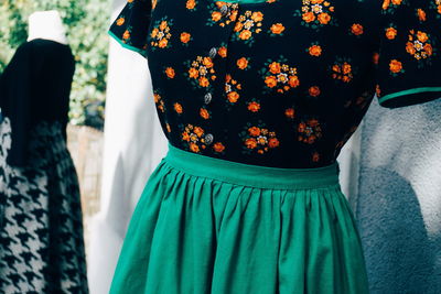 Close-up of dresses hanging at market for sale