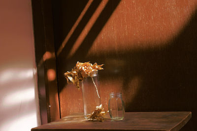 Close-up of glass vase on table at home