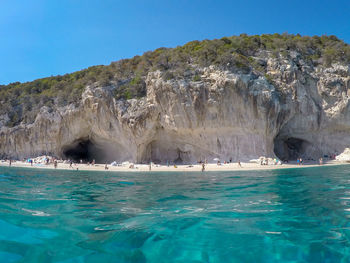 Scenic view of sea against clear blue sky