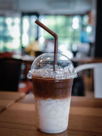 Close-up of coffee in glass on table