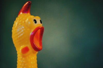 Close-up of a stuffed toy over black background