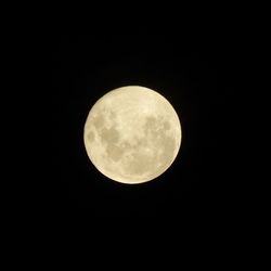 Low angle view of moon against sky at night