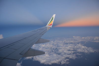 Aerial view of airplane flying in sky