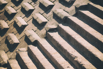 High angle view of empty steps on sunny day