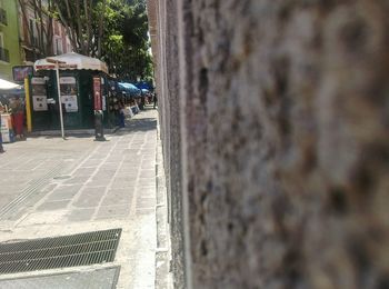 Close-up of man on brick wall