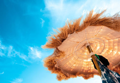 Beach beautiful thatched umbrellas and turquoise sea.