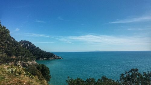 Scenic view of sea against blue sky