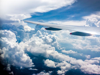 Low angle view of airplane flying in sky