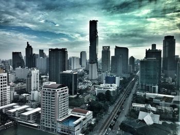 High angle view of modern buildings in city against sky