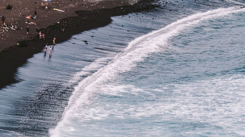 High angle view of waves on beach