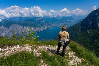 Rear view of man standing on mountain