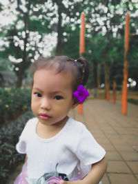 Portrait of cute girl standing outdoors