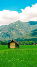 House on mountain against sky