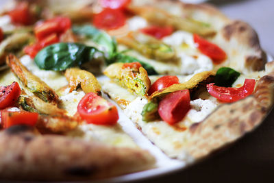 Extreme close-up of pizza served in plate