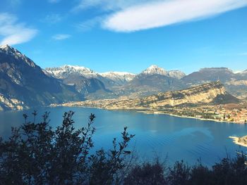 Scenic view of lake and mountains against sky