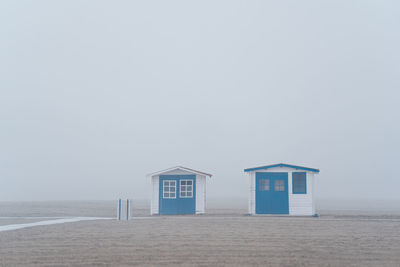 Beach hut on misty morning