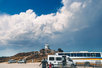 Panoramic view of cars on mountain against sky