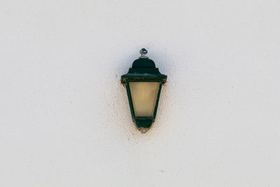 Low angle view of gas light on white wall