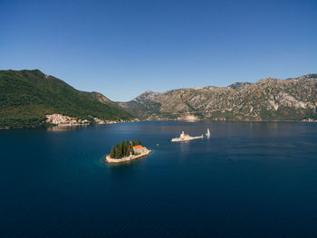 Scenic view of sea against clear blue sky